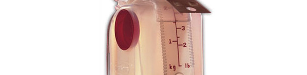 Feed dispenser with adjustment scale in kg and lb.