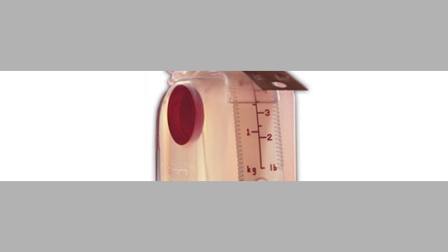 Feed dispenser with adjustment scale in kg and lb.