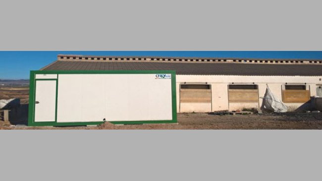 It can be a prefabricated cabin like the ones used in the construction sites, with its entrance on one side and the exit on another side